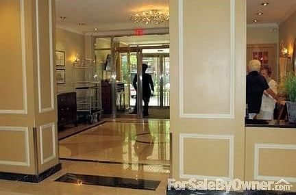 Lobby
						:
						Front Entrance view from elevator lobby. 3 elevator cabs, 16 story plus cellar