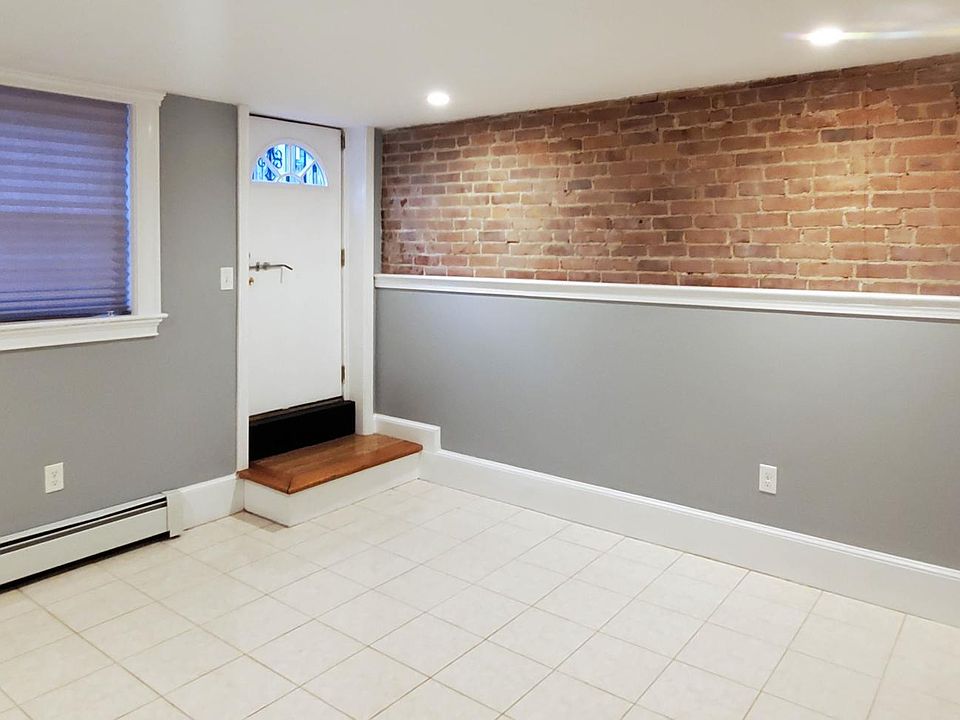 This property features 3 levels with TONS of exposed brick. 2 BR + full bath on top floor & one large BR + BA (w/shower!) on lower level (pictured)