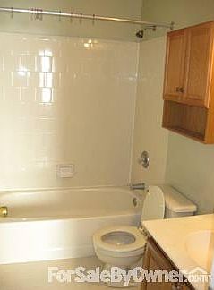 Bath off Master Bedroom (1) : Additional storage space and upgraded medicine cabinet; tiled flooring
