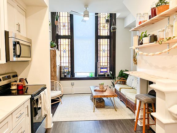 Stained glass and cozy corners accentuate the beauty of this unique loft in the heart of the arts district.
*Photo similar to available unit