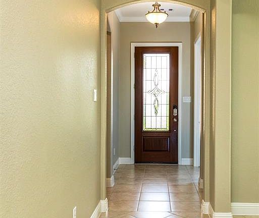 Step through the beautiful, keyless entry front door into the tastefully upgraded tile lined entry.