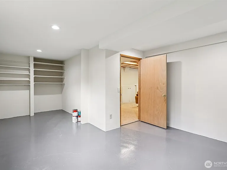 bonus room (storage) connecting lower living room to carport entrance