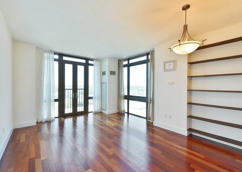 Living room/dining area with built-ins.