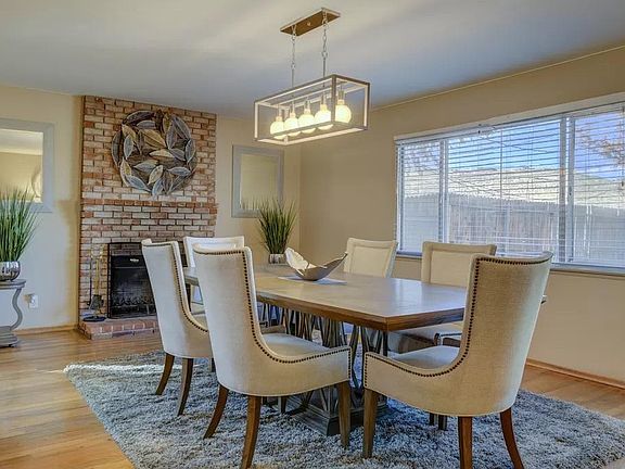 With a elegant fireplace, spacious table, and warm lighting, you'll love spending time in the gorgeous dining room.