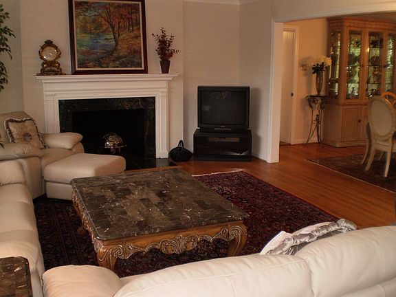 Formal Living Room opens to dining room for entertaining.