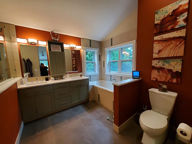 Primary bathroom has heated tile floors throughout, walk-in shower with rain head and personal shower, double vanity and a whirlpool soaking tub.