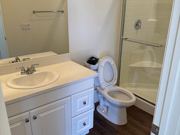 View of downstairs bathroom with walk-in shower.