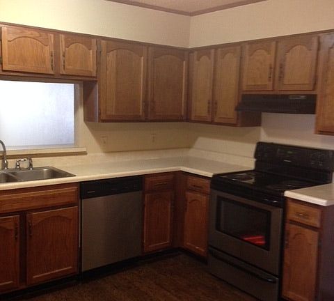 large kitchen with stainless steel appliances and lots of ca