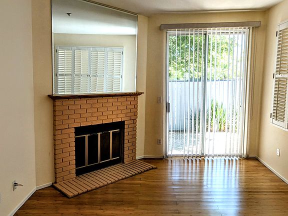 Living room view from dining room with fireplace