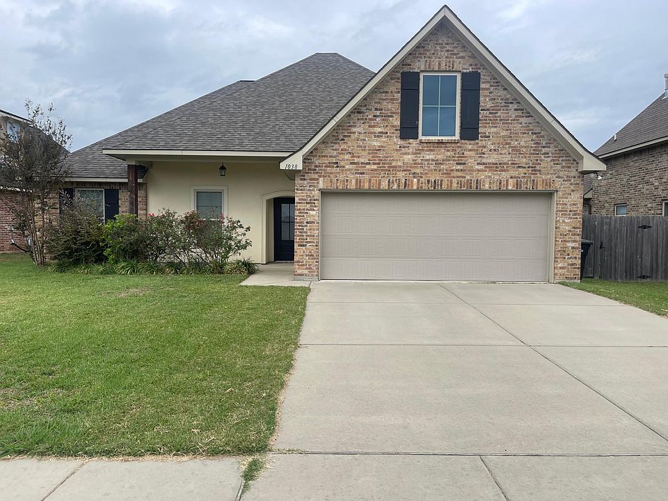 Front Entry, covered sitting area, 2 car garage