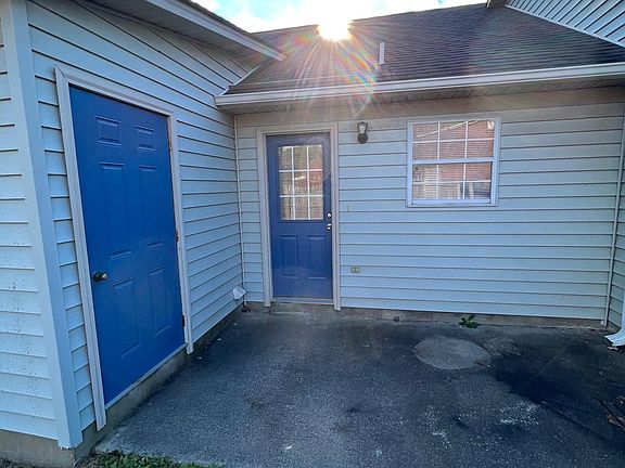 Back patio with attached storage closet.
