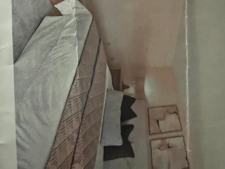 View of first master bedroom; furnishings not included