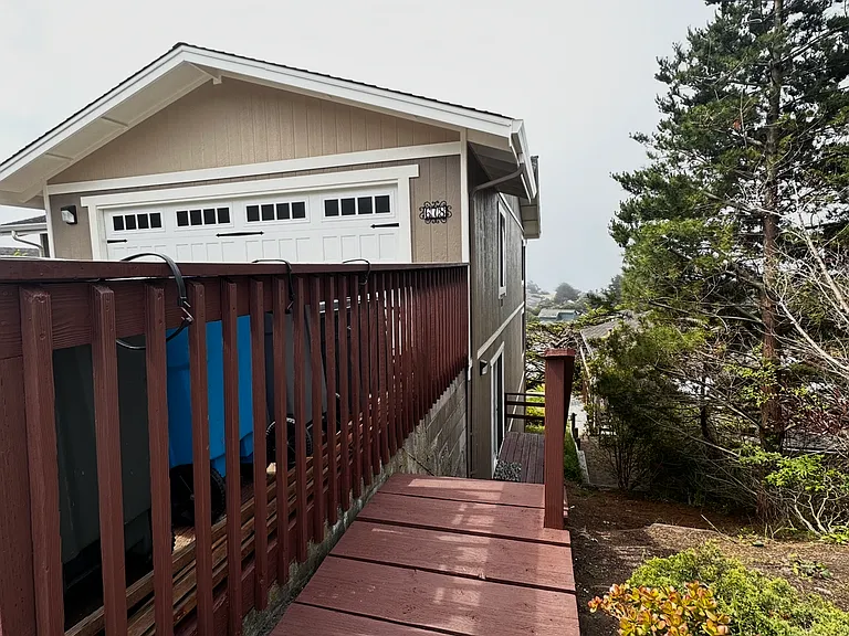 Side private entrance to the other bedroom with a deck and side oceanview