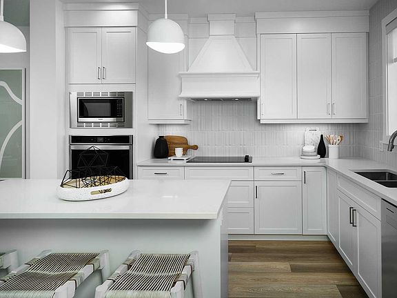 A photo of the kitchen in the Alder duplex model by Brookfield Residential