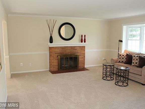 Bay window and fireplace set the tone of this room