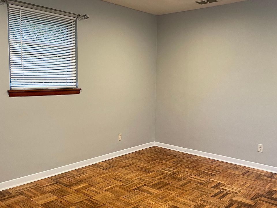 Living room with newly refinished hardwood flooring.