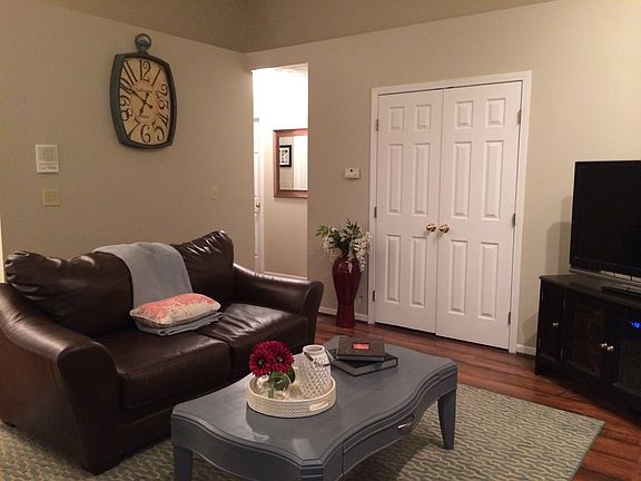 Living room, double doors to third bedroom or large home off