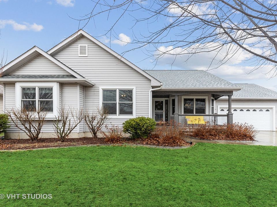This outside has a nice front porch for you to sit and enjoy the neighborhood! This is on walking di