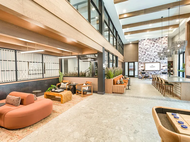 Expansive and artfully designed, the clubhouse at Modera Higley Commons offers inviting spaces to gather, unwind, and connect.