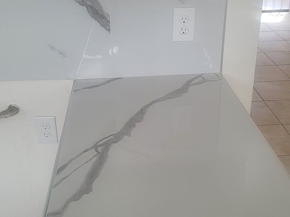 PORTION OF KITCHEN COUNTER TOP