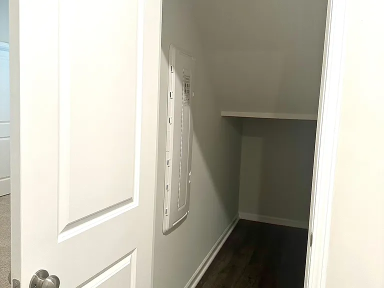 Foyer storage space under strair.