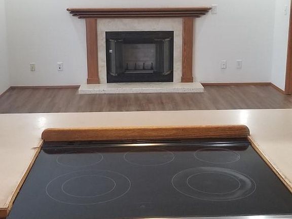 KITCHEN PASS THROUGH TO BONUS ROOM WITH FIREPLACE