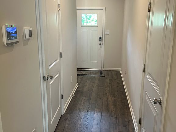 Main entrance corridor. Left door powder room and right door garage entrance.