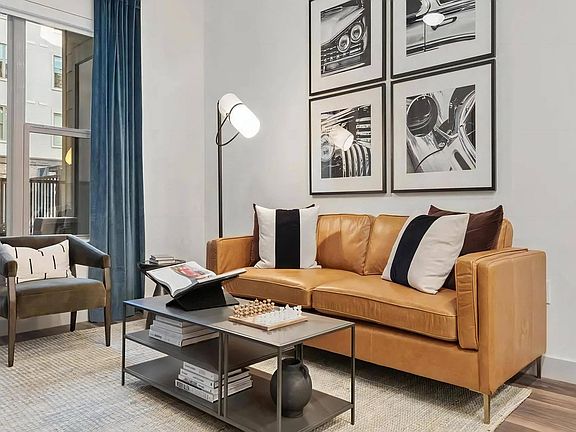 Apartment Lounge Space with Coffee Table and Tall Floor Lamp