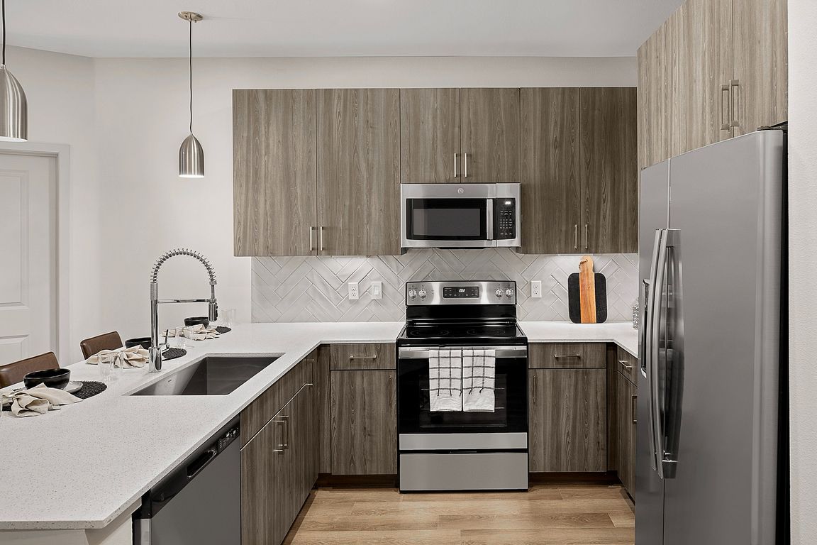 Welcoming Kitchen witth Stainless Steel Appliance Package