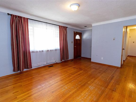 Wood floors and coved ceiling in the living room