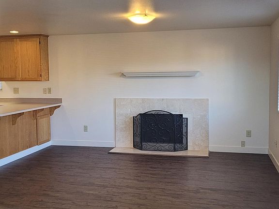 The living room is upstairs, and the kitchen is just around the corner.