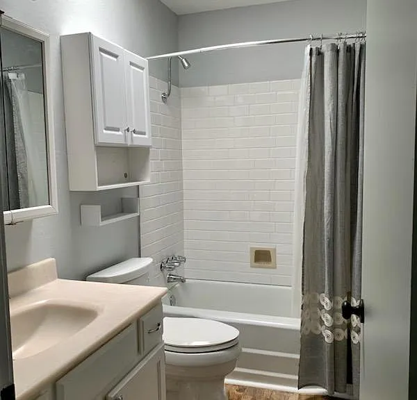 Bathroom with original cultured marbled countertop, new fixtures & freshly painted.