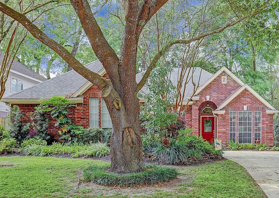 Mature trees and a quiet street make this home a sanctuary.