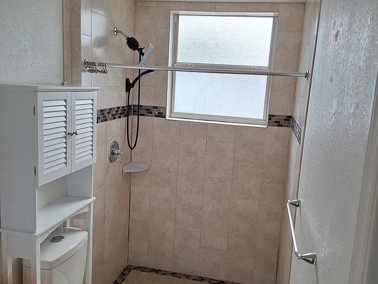 Adjoining bathroom with Shower and double sinks