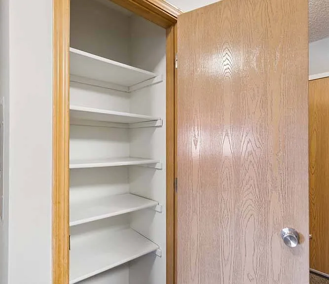 Extra built-in shelving provides a practical storage solution, giving everything a dedicated place while keeping your home effortlessly organized.
