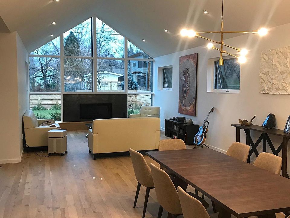 Dining Room and Living Room with Furnishings and Art.