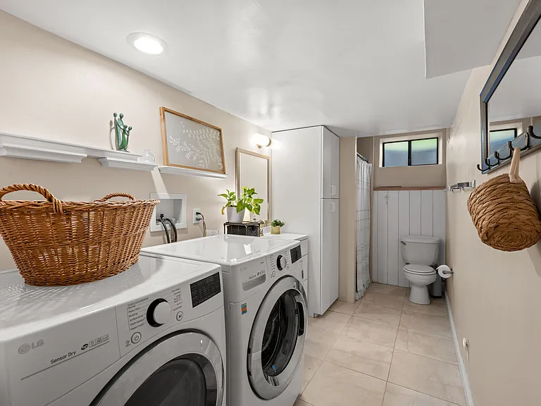Basement apartment laundry (washer/dryer included) and full bathroom with standing shower