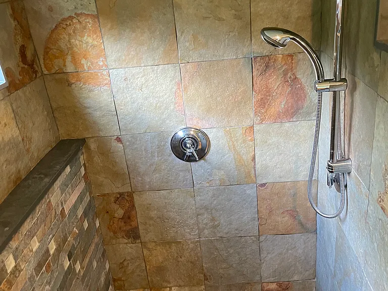Master Bedroom En suite large shower. River rock shower floor and 2 shower heads.