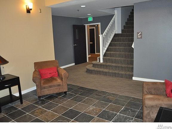 Beautiful lobby entrance leads to stairs and elevator.