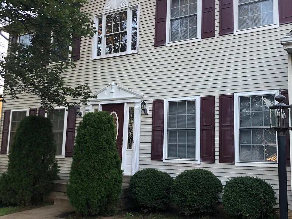 Street view of house. Attached two car garage to right.