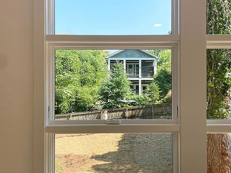 Big windows look north over yard - gardeners welcome.
