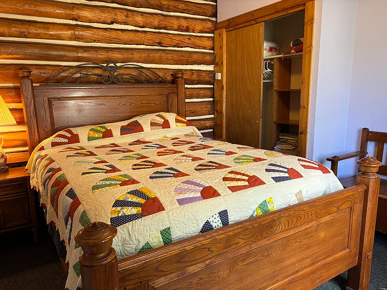 Queen bed looking out over stream