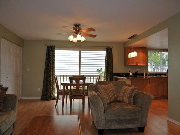 As you enter the home from front door and turn left, you will find this area, with skylight above, plenty of room for couch, TV, easy chair, and second eating area, all open to the kitchen for easy entertaining and conversation. The door to the left leads to the garage, and the bifold doors between slider and garage door open to large, well lighted laundry area. Well thought out floor plan!