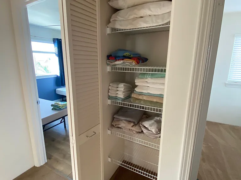 Hallway closet between 2 guest bedrooms