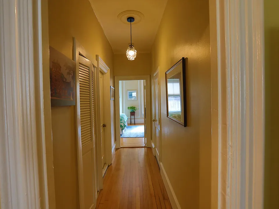 Floor-through hallway from Living area looking toward bedroom & bathroom