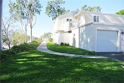 Front exterior of building and sidewalk to unit