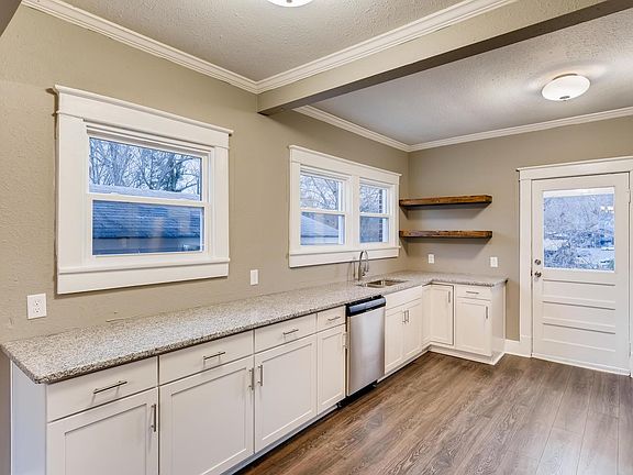 Updated kitchen with solid surface counters and stainless appliances.