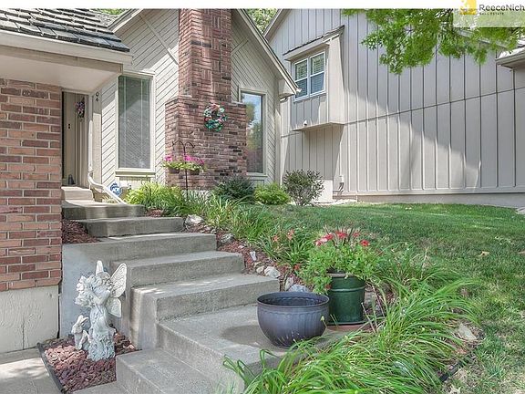 This house makes you want to stop & smell the roses!