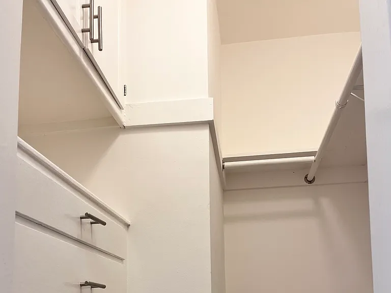 Closet 1 - Built in dresser and storage.