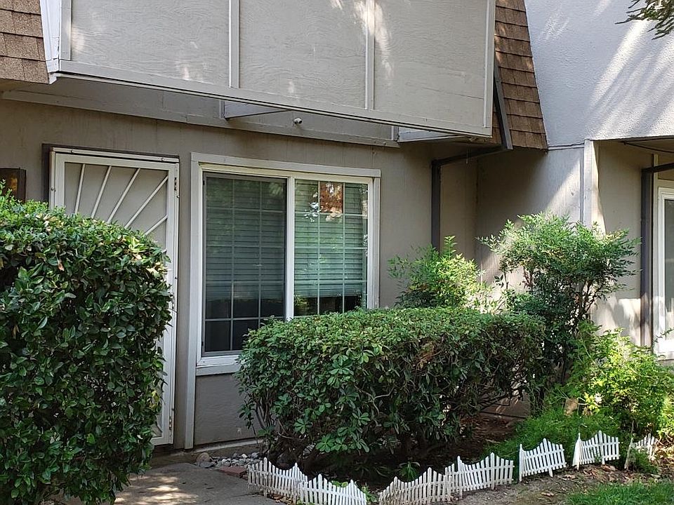 Front door, security gate facing greenbelt